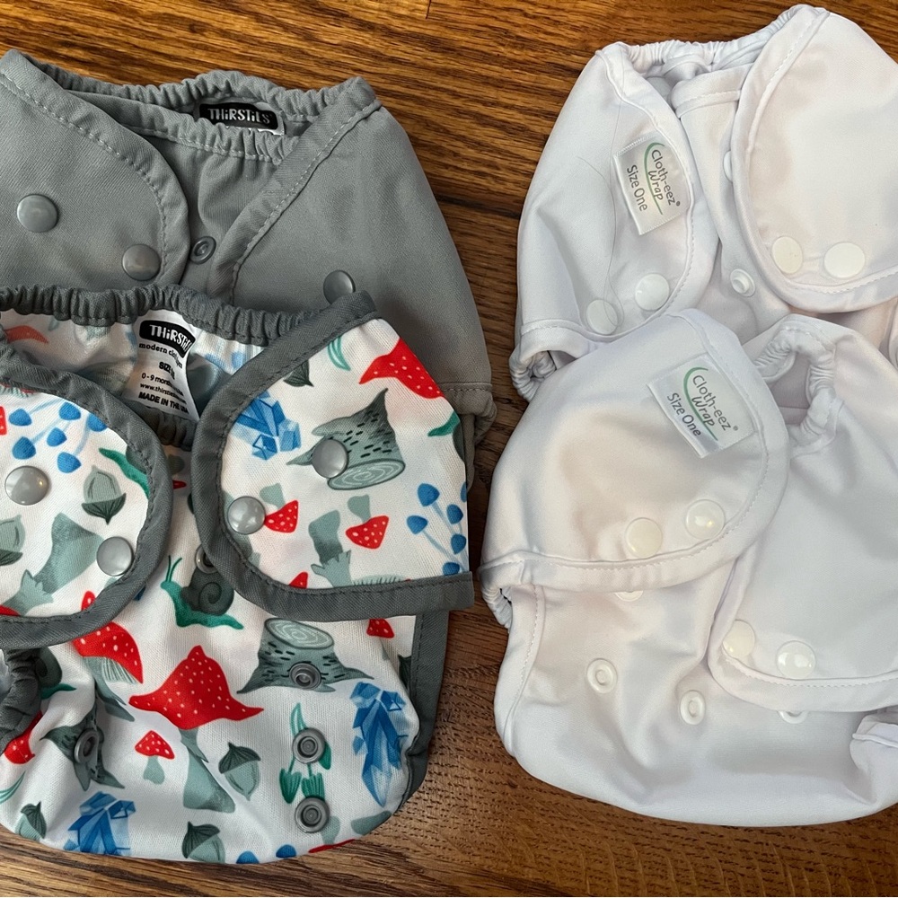 Set of 4 Like-New Size 1 Cloth Diaper Covers
